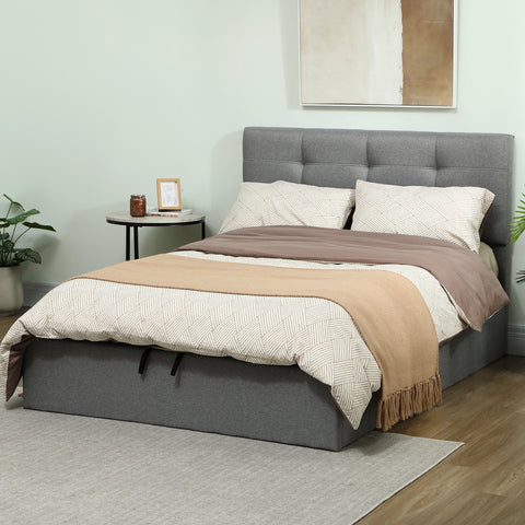 Gray tufted upholstered ottoman bed frame with gas lift storage base and beige patterned bedding suitable mattress option