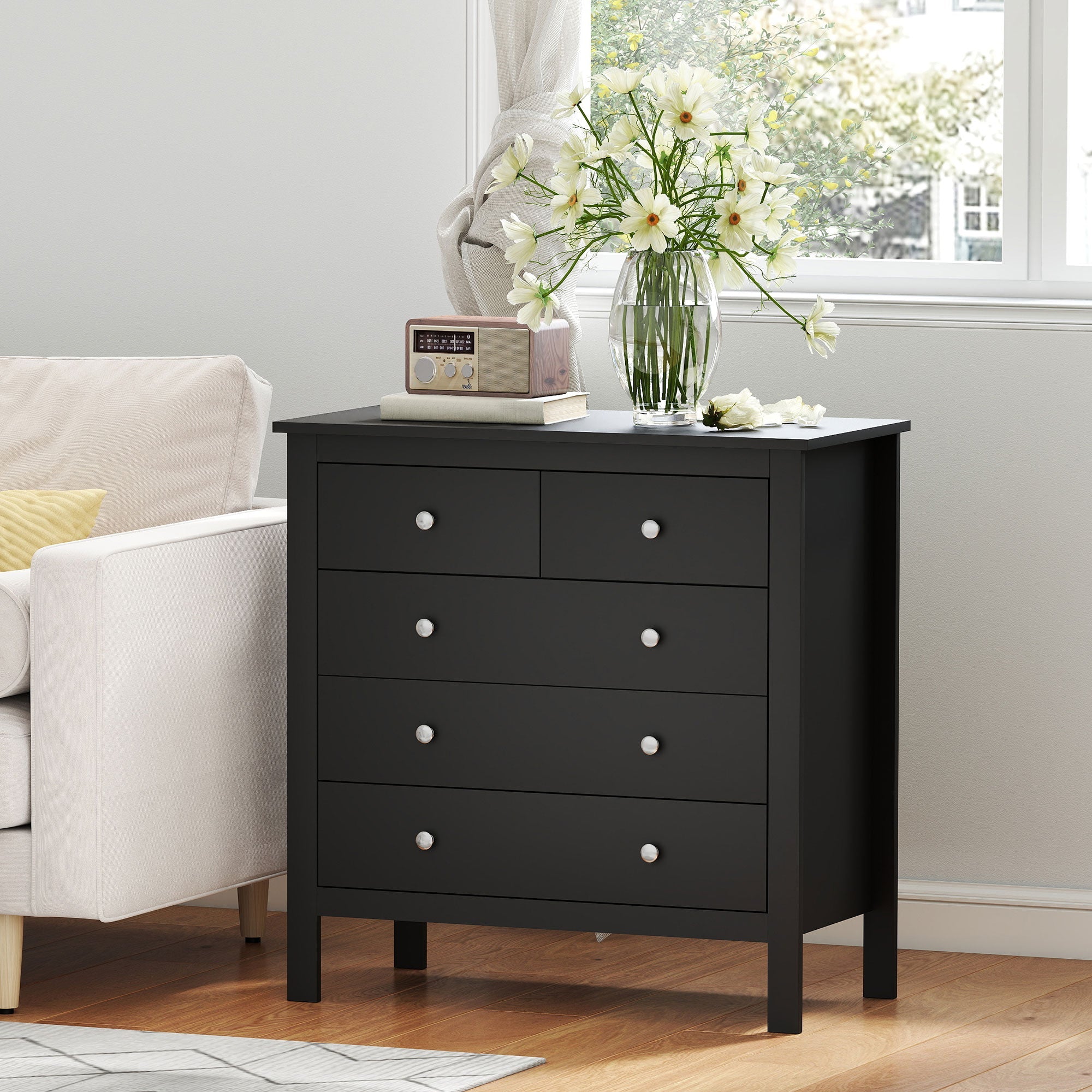 Black wooden 4 drawer dresser with silver knobs made of mdf construction perfect for bedroom storage