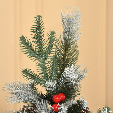 Frosted green artificial christmas tree branch with red berries white pinecones and subtle silver glitter decoration
