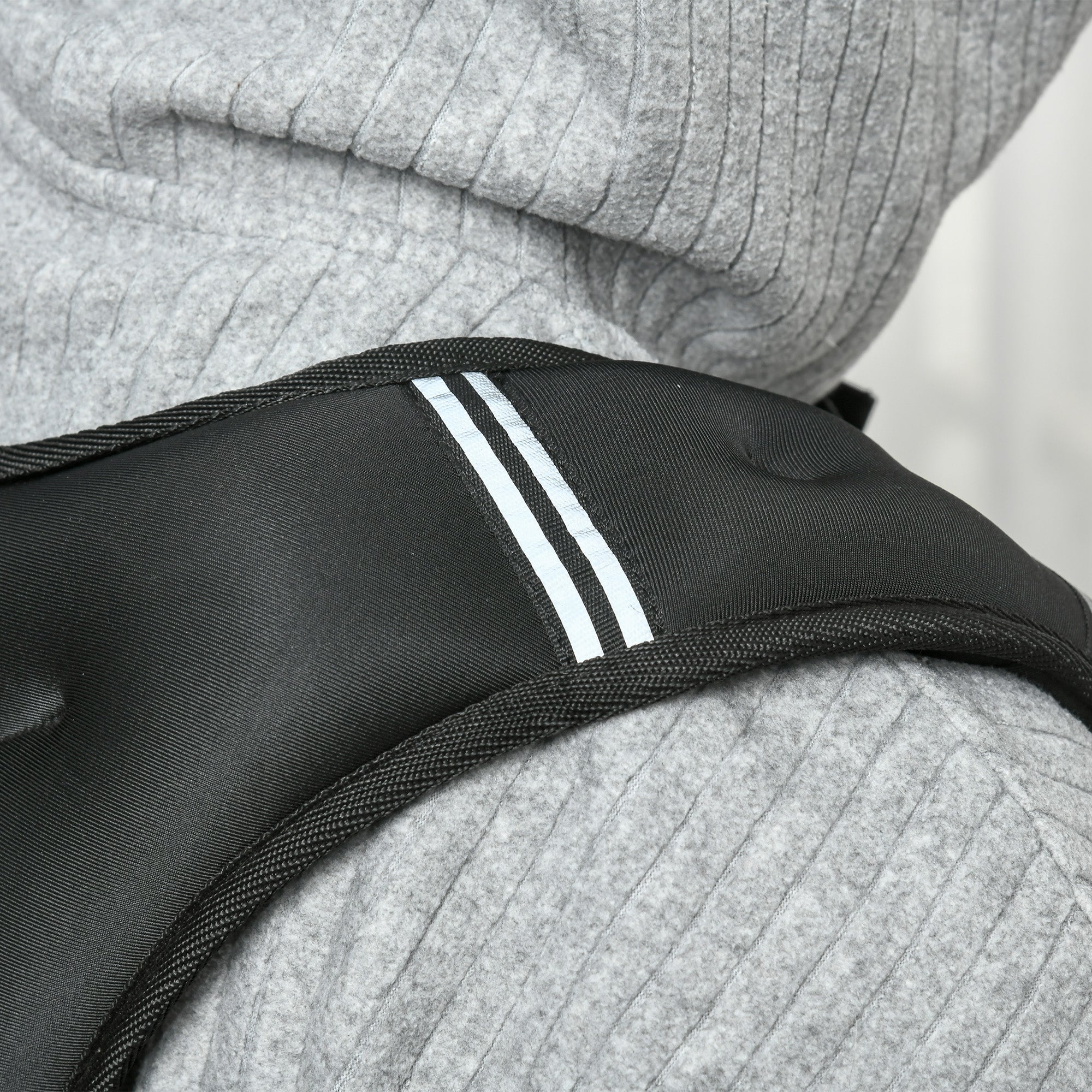 Black oxford fabric strap with two white reflective strips on the back of homcom running weight vest for cardio workouts