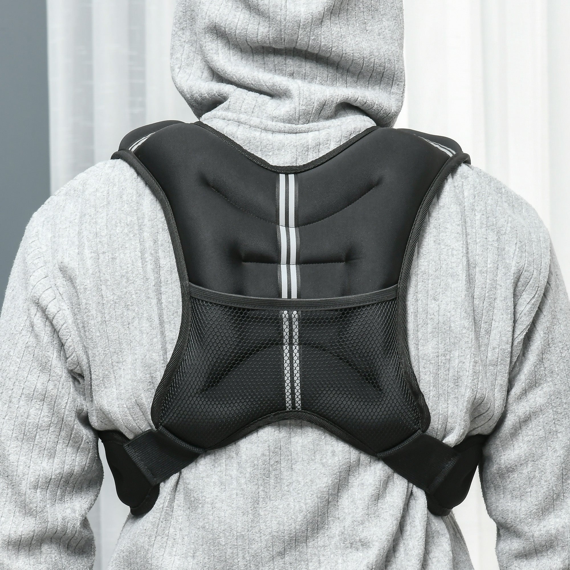 Black neoprene back support vest with mesh panels and reflective stripes for running weight vest cardio exercise