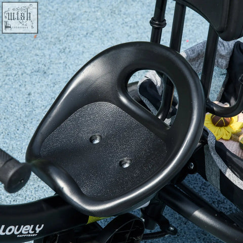 Black plastic child seat with textured grip and central cutout for homcom 6 in 1 kids trike with safety belt and parent-push handle