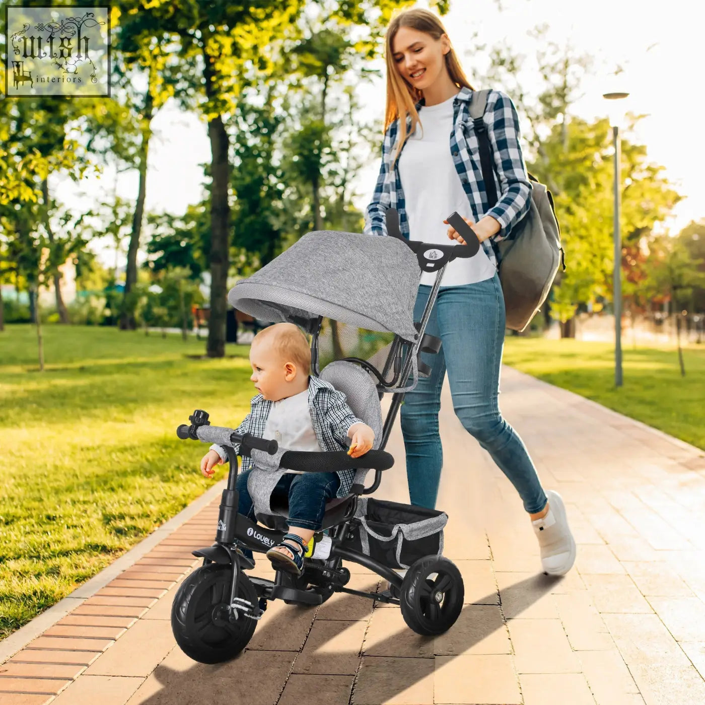 Gray fabric canopy tricycle with black frame and three wheels features a safety belt and parent-push handle for kids