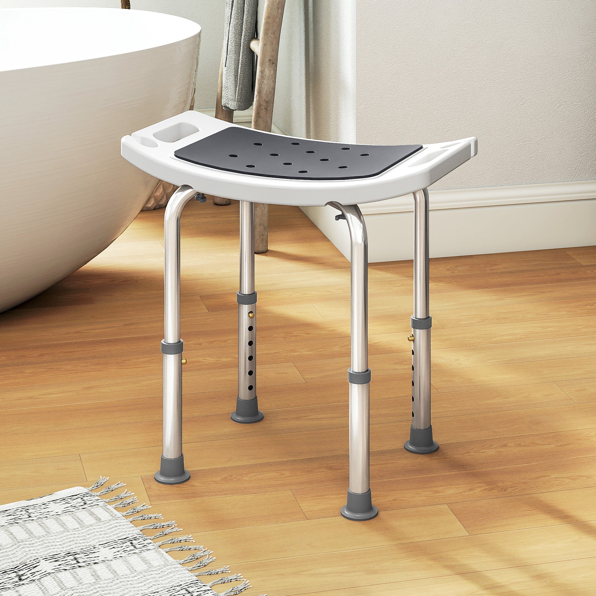 Adjustable height bath chair with white plastic frame gray rubber foot pads black perforated seat and drainage holes 52w x 31d