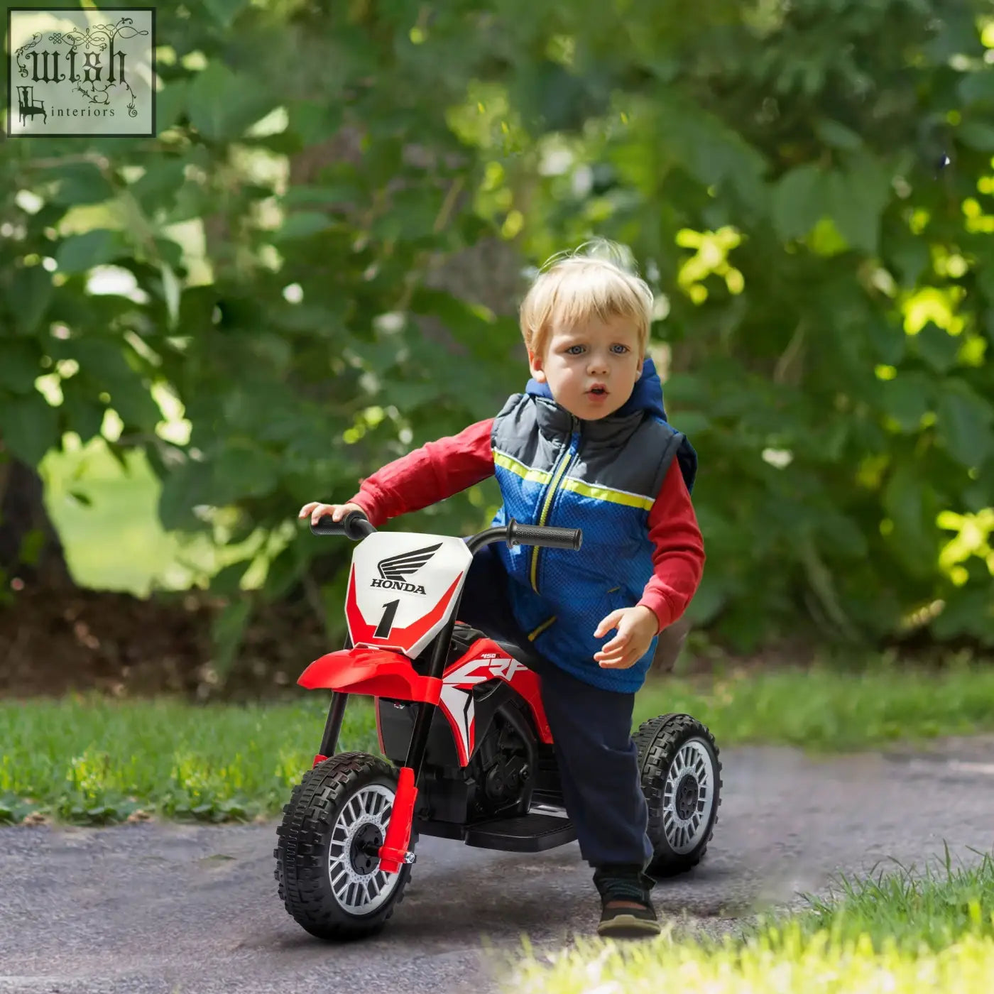 Red and white honda kids electric three-wheel ride-on motorcycle with black wheels and start-up sounds for toddlers