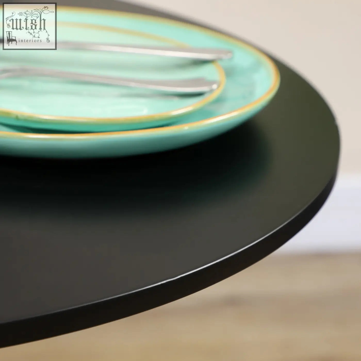 Turquoise ceramic plates with gold rims stacked on black round table with powder coated steel frame by HOMCOM