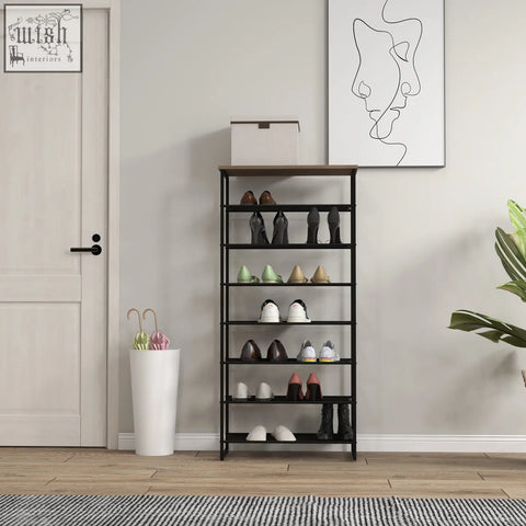 Black metal shoe rack with wooden top shelf features a narrow seven-tier design and anti-tipping straps included