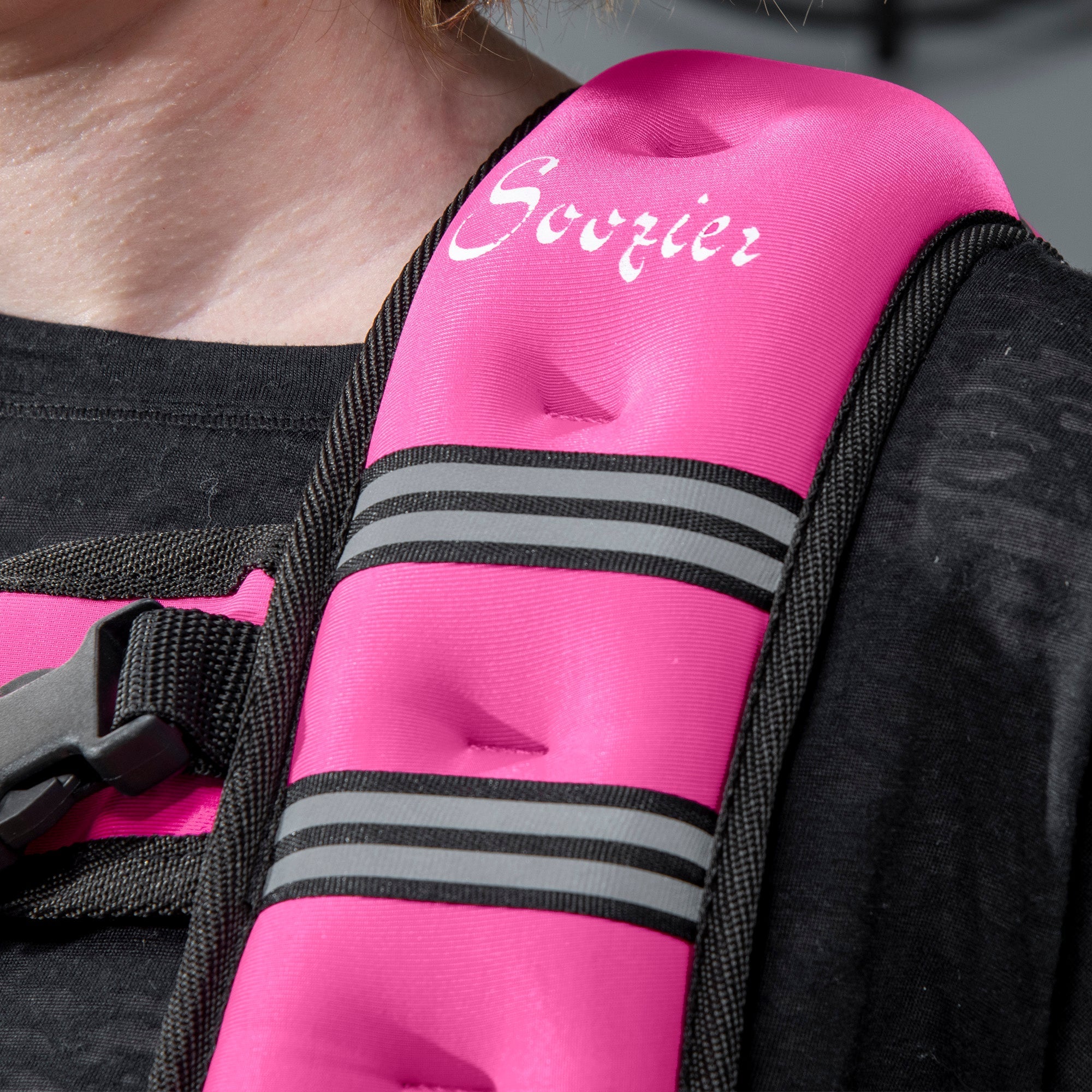 Pink inflatable weight vest with black straps and reflective strips made of oxford fabric for running by sovrier