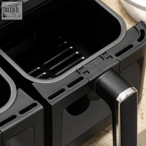 Black plastic air fryer basket with ridged interior and silver-accented handle for homcom 8l dual basket air fryer