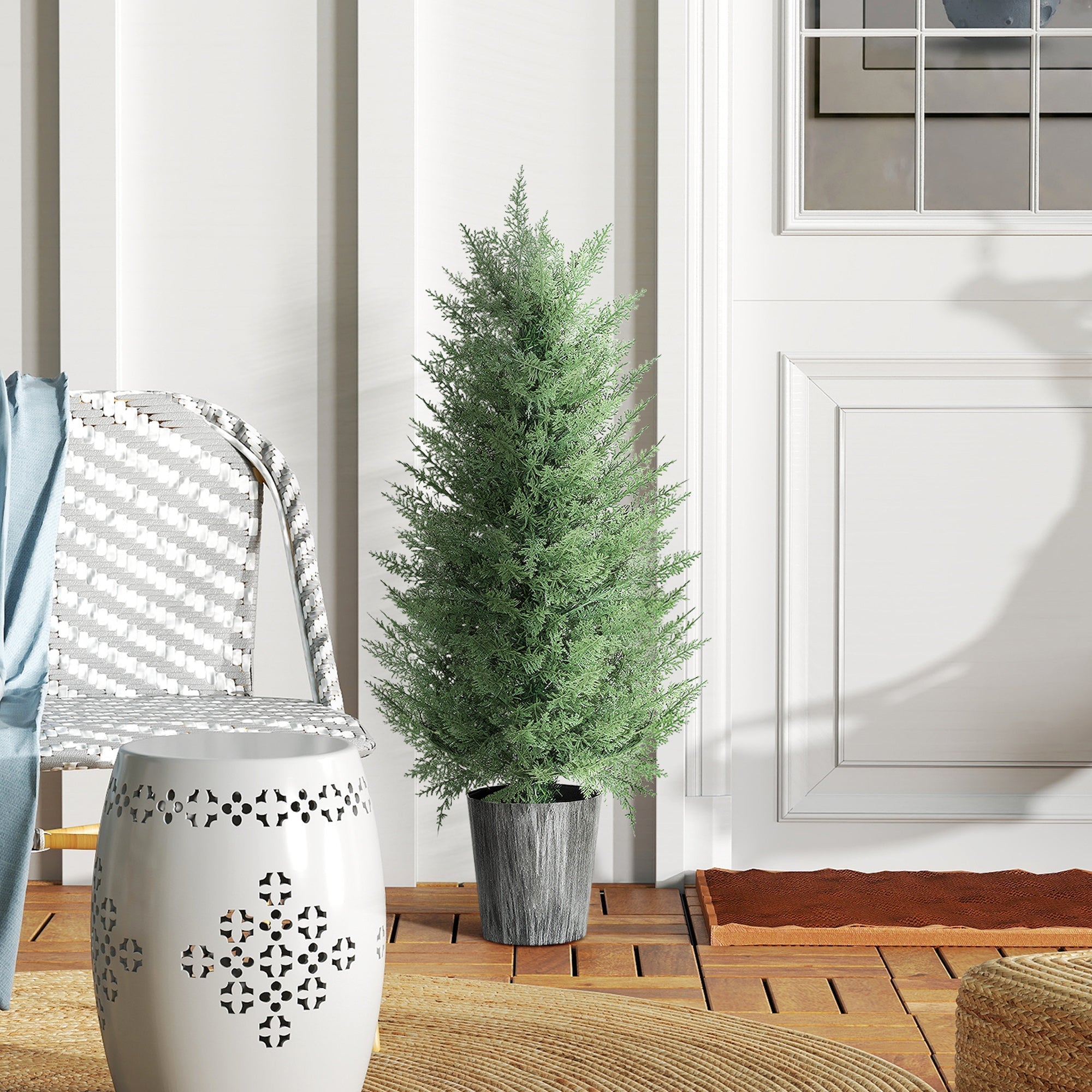A tall artificial cypress tree with dense green foliage in a textured gray pot perfect for indoor or outdoor decor