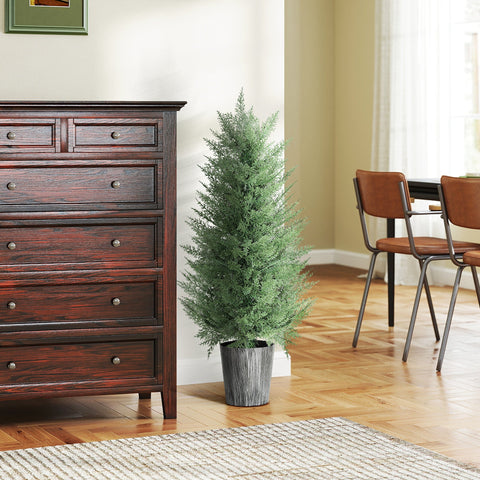 A tall green artificial cypress tree with dense foliage in a textured gray pot for indoor outdoor decor