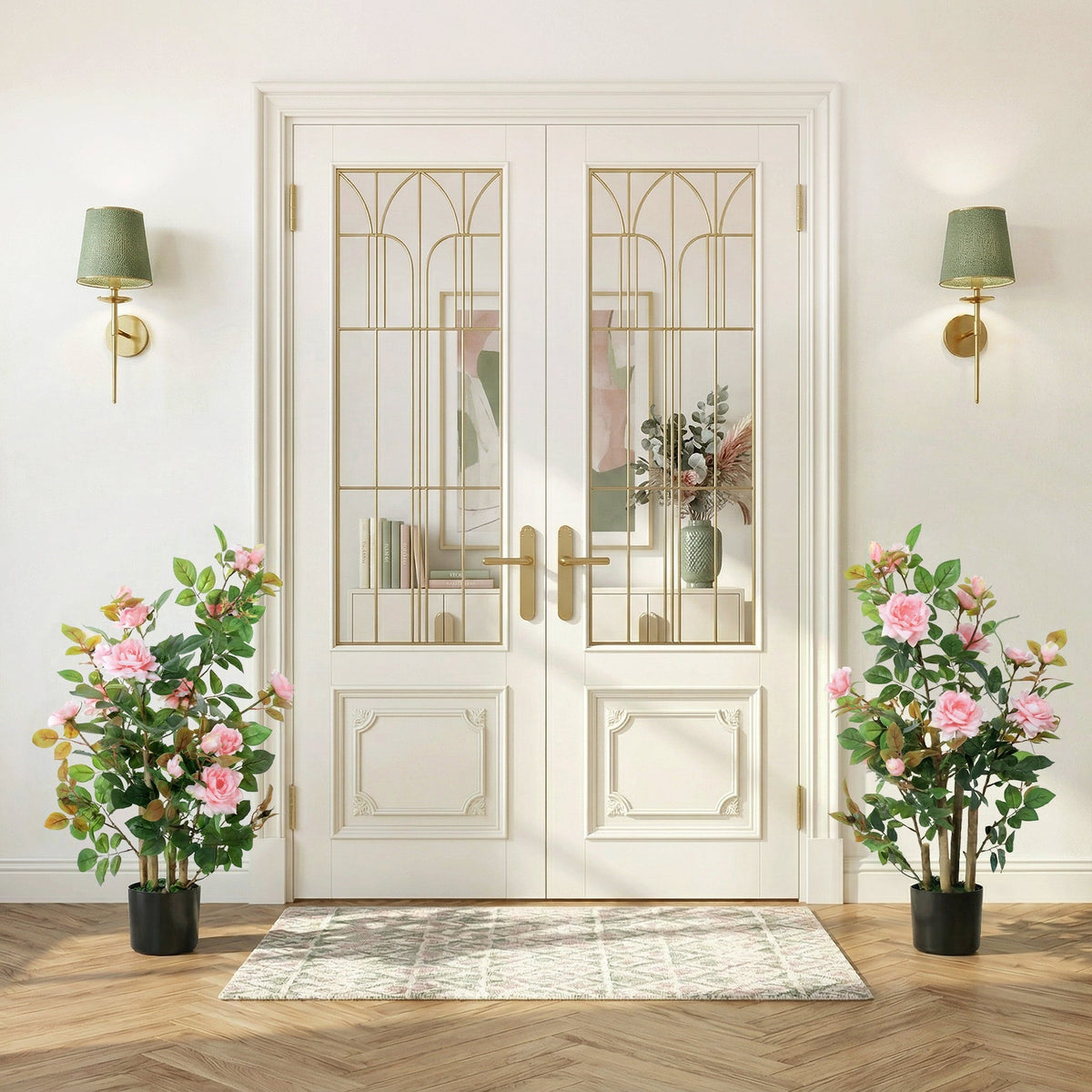 White double doors with gold metal frame and glass panels next to pink artificial rose tree set with silk leaves and flowers