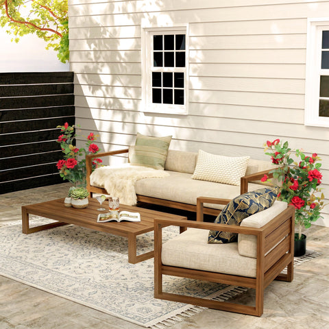 Beige upholstered outdoor sofa set with wooden frame and patterned throw pillows next to homcom artificial red rose tree set