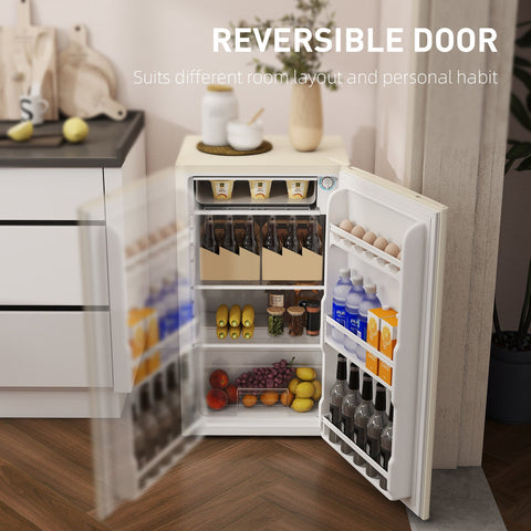 Beige homcom 91 litre small fridge freezer with reversible door and organized shelves stocked with drinks and produce