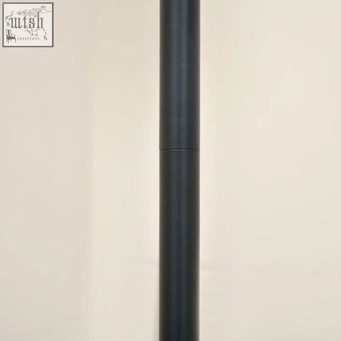Black matte finished cylindrical pole of homcom arc tree floor lamp with steel frame and round base for living room