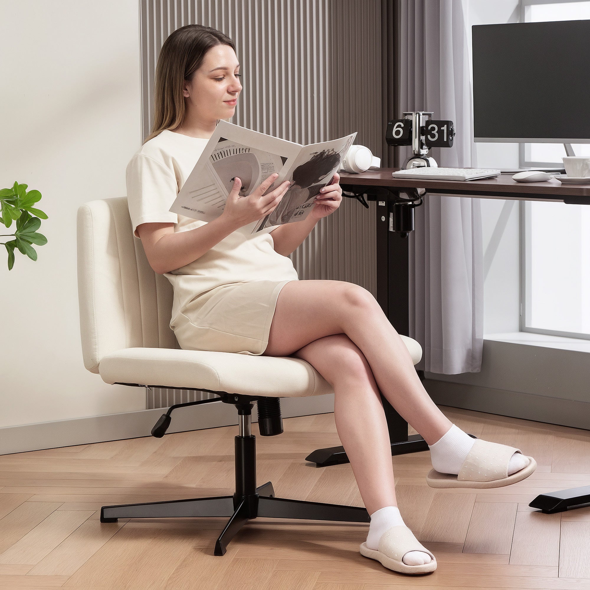 Cream-colored office chair with breathable linen-feel fabric and black metal base for home office use