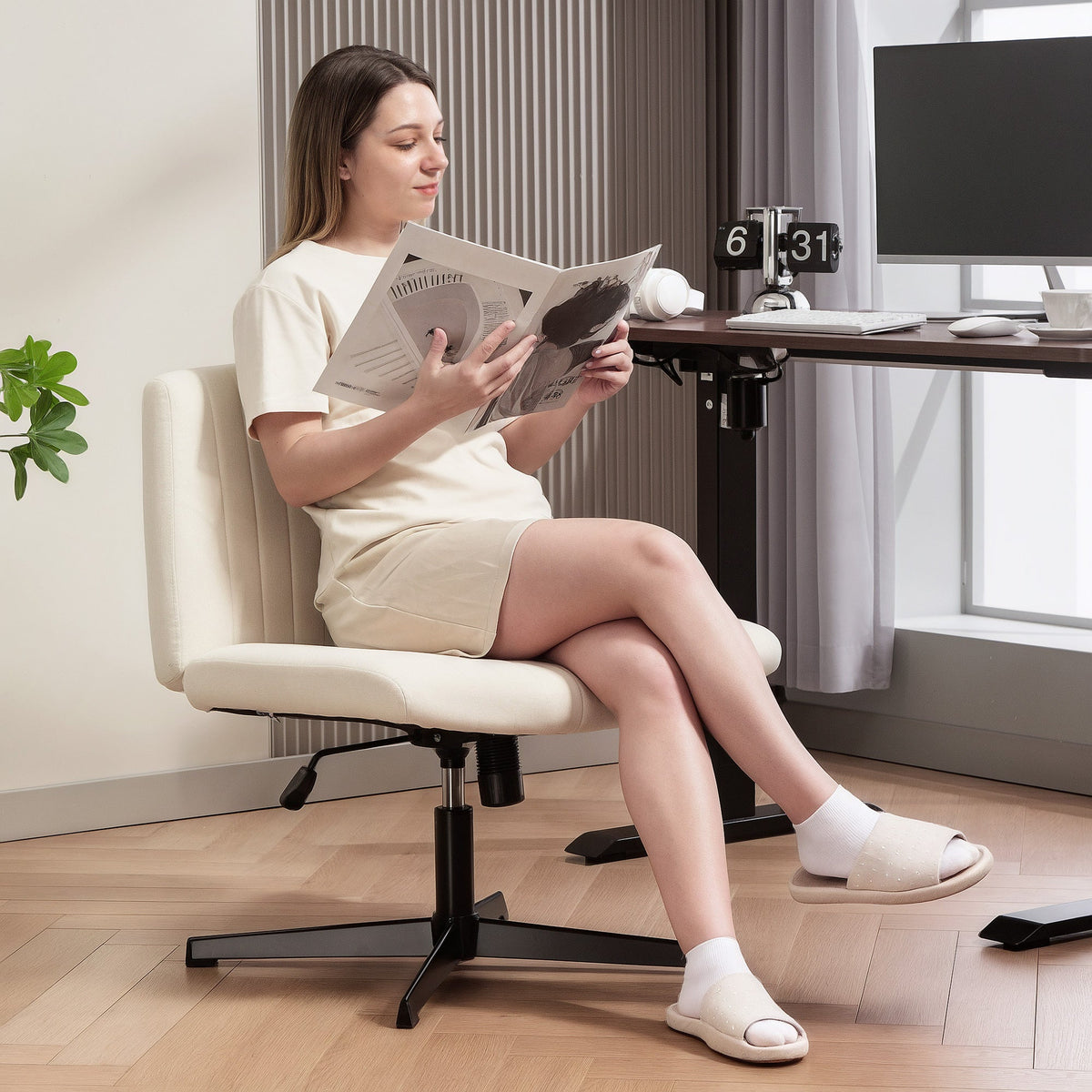 Cream-colored office chair with breathable linen-feel fabric and black metal base for home office use