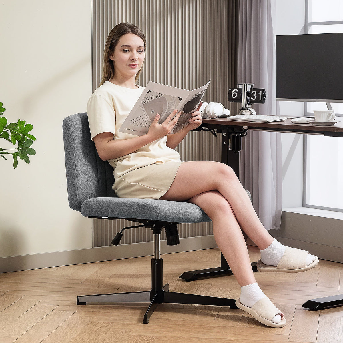 Gray upholstered office chair with breathable linen-feel fabric and black metal star base for home office use