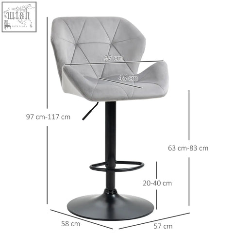 Gray upholstered bar stool with velvet-feel upholstery, round base, and metal frame footrest for kitchen or bar use