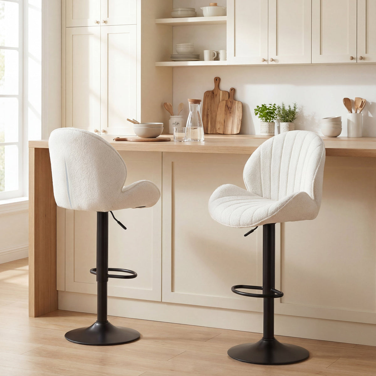 Cream white upholstered homcom bar stools with black metal bases and smooth gas lift for adjustable height and swivel use
