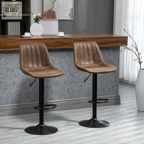 Brown tufted leather bar stools with black metal bases and adjustable footrests perfect for kitchen island use