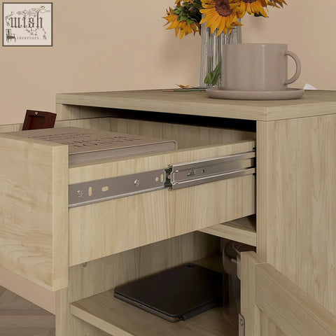 Light wood-grain homcom bedside table with rattan weave panel, drawer with metal slides, and shelves holding laptop and tablet