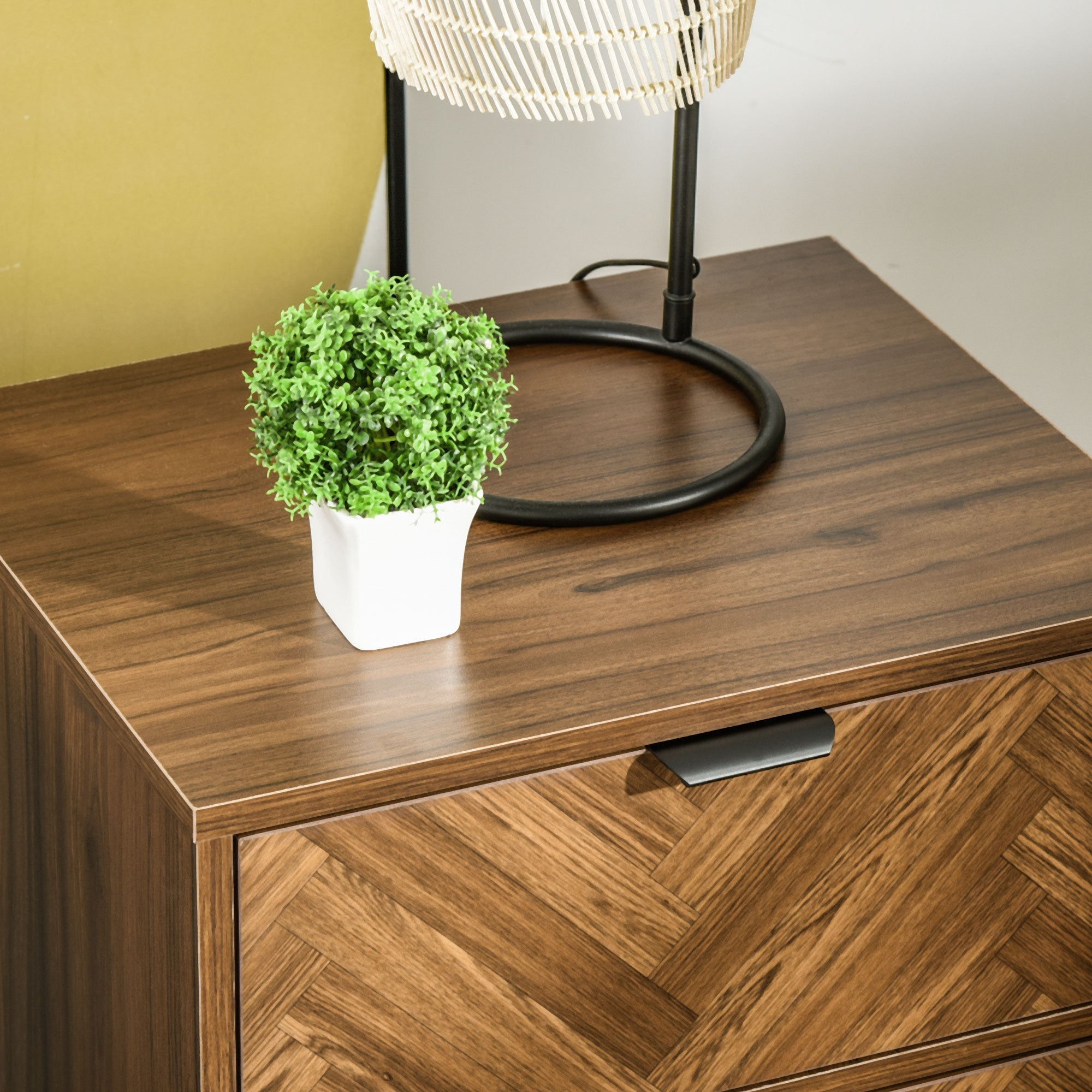 Homcom bedside table with two drawers in walnut brown particle board holding a white ceramic pot with green shrub