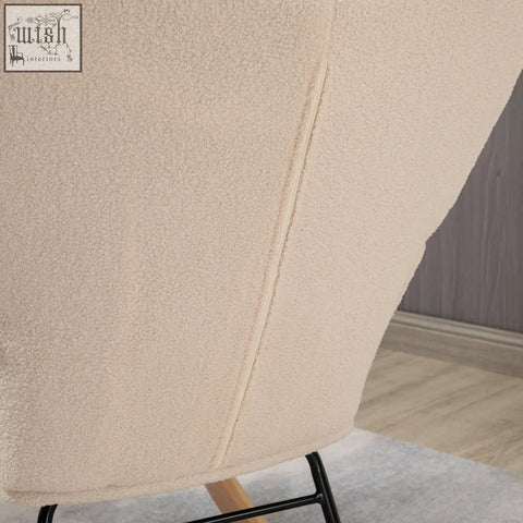 Cream-colored homcom nursery glider rocking chair with textured fabric and sleek black metal frame for gentle rocking