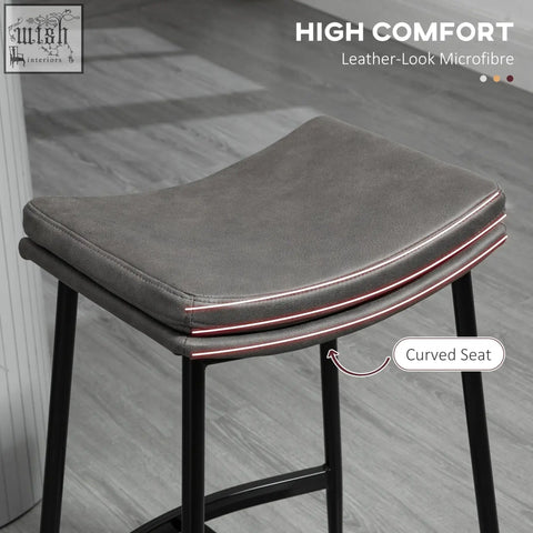Gray leather-look microfiber breakfast bar stools with curved seat and black steel frame for kitchen or dining room
