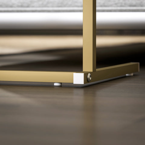 Gold-toned metal frame with white plastic feet on the homcom c-shaped bedside table with marble grain and power outlets