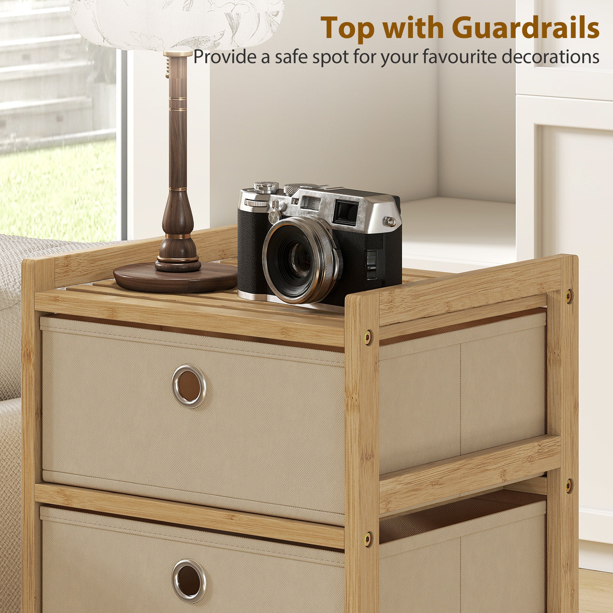 Silver and black vintage-style camera on a homcom chest of drawers with three fabric drawers and bamboo frame cream white