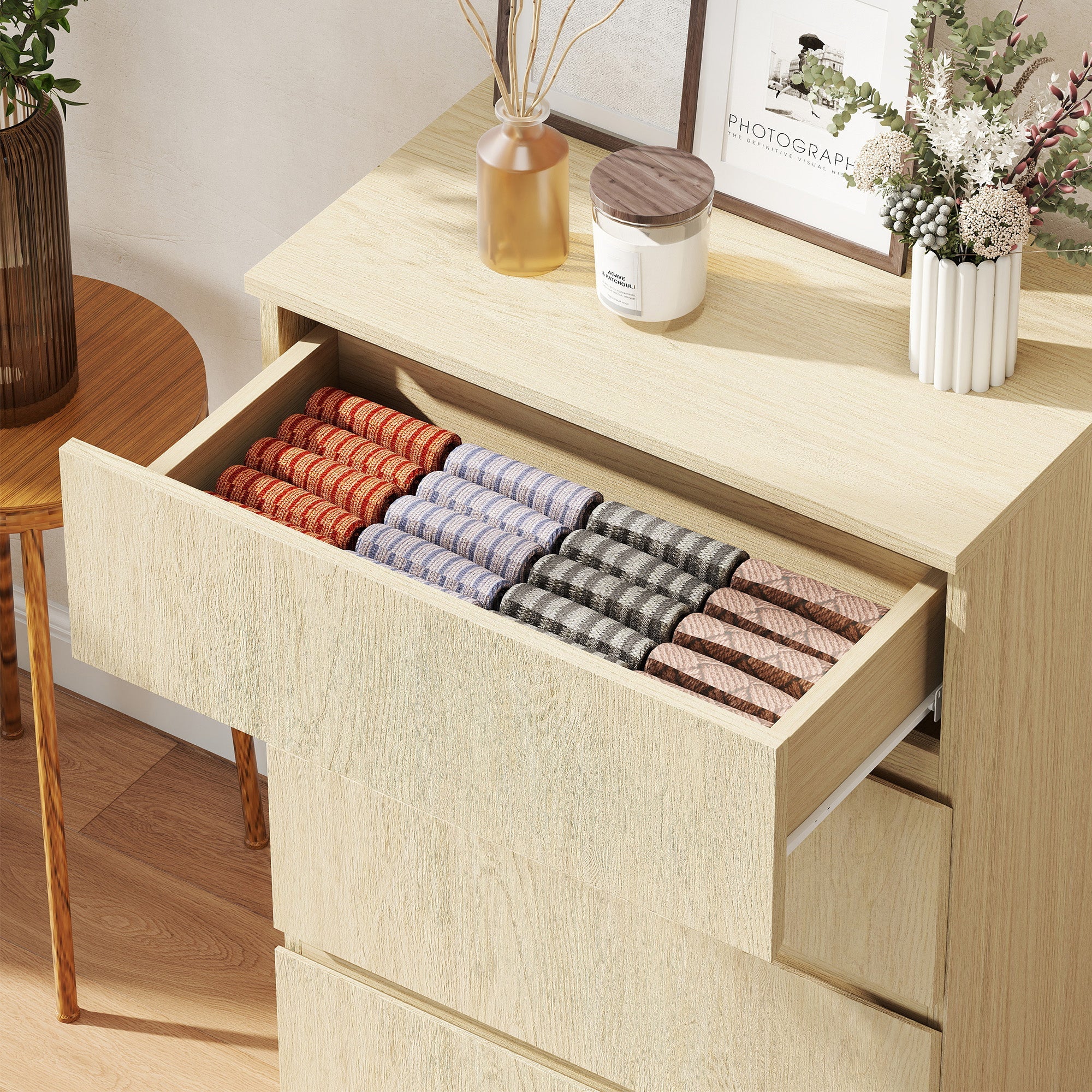 Homcom chest with four drawers in light wood finish and handle-less design holding colorful patterned socks neatly organized
