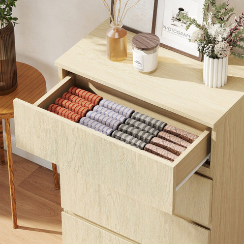 Homcom chest with four drawers in light wood finish and handle-less design holding colorful patterned socks neatly organized