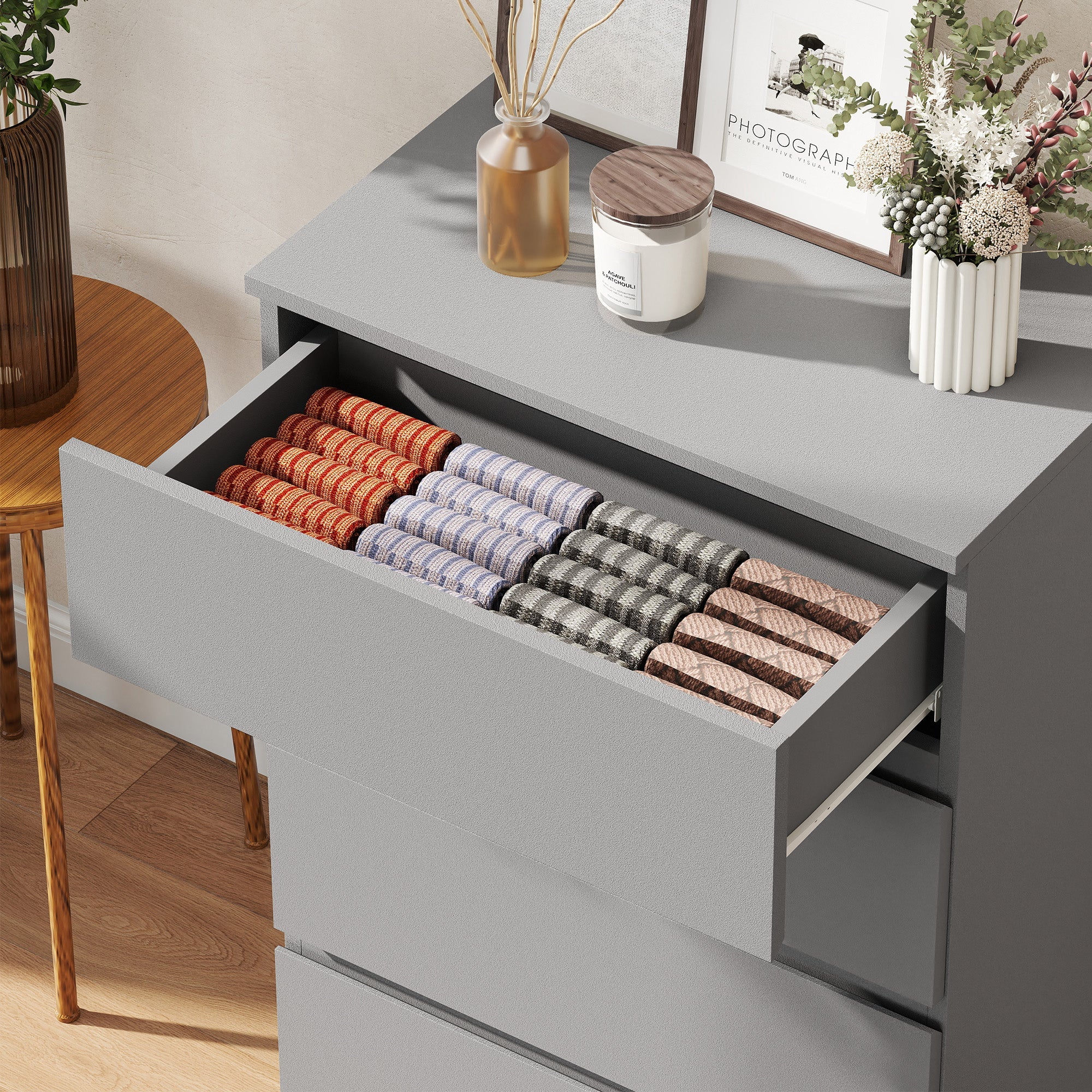 Gray drawer organizer filled with neatly stacked socks inside homcom chest with four drawers and handle-less design