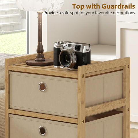 Silver and black vintage camera resting on cream white homcom chest of drawers with four fabric drawers and bamboo frame