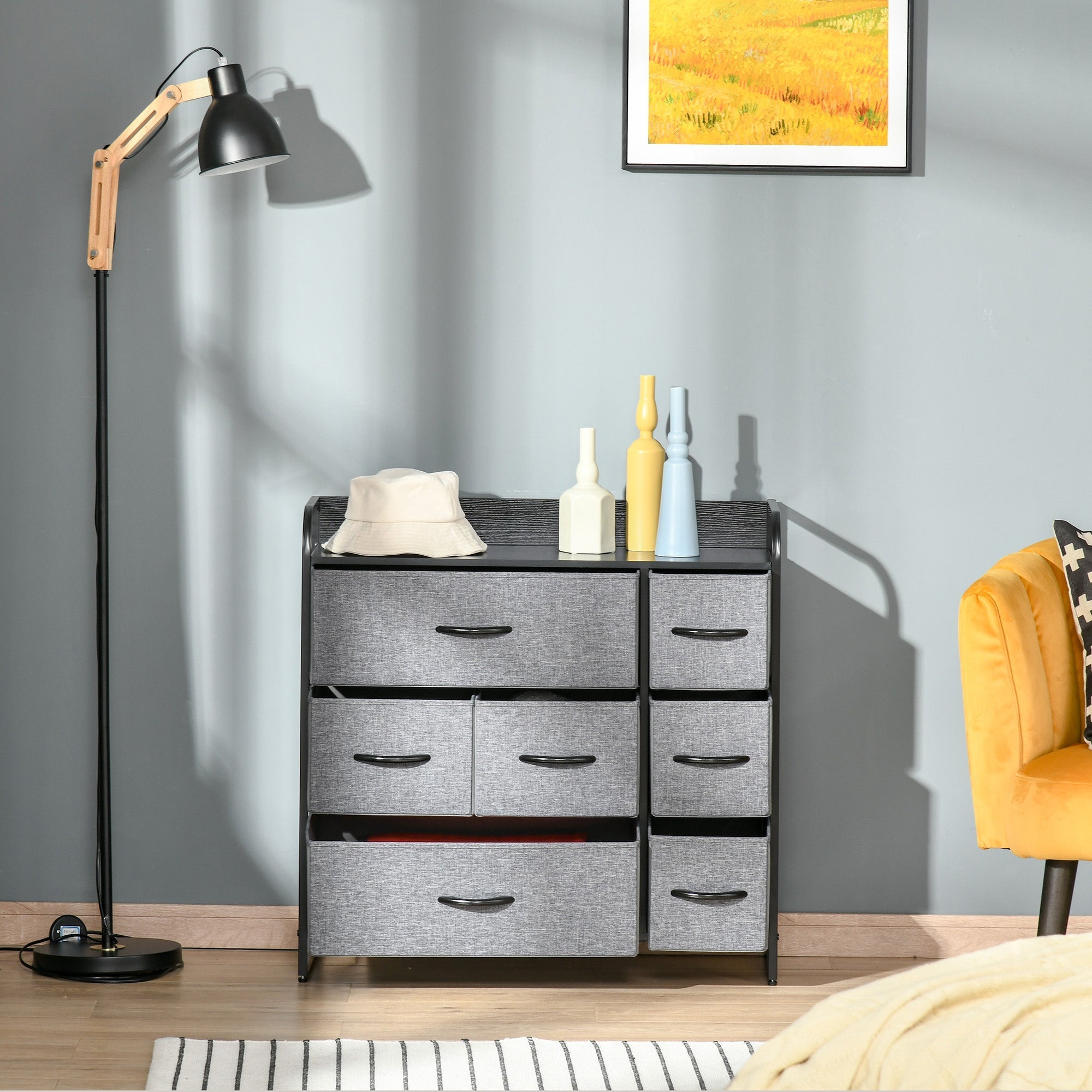 Gray fabric chest of drawers with black metal frame featuring two large two medium and three small foldable drawers for storage