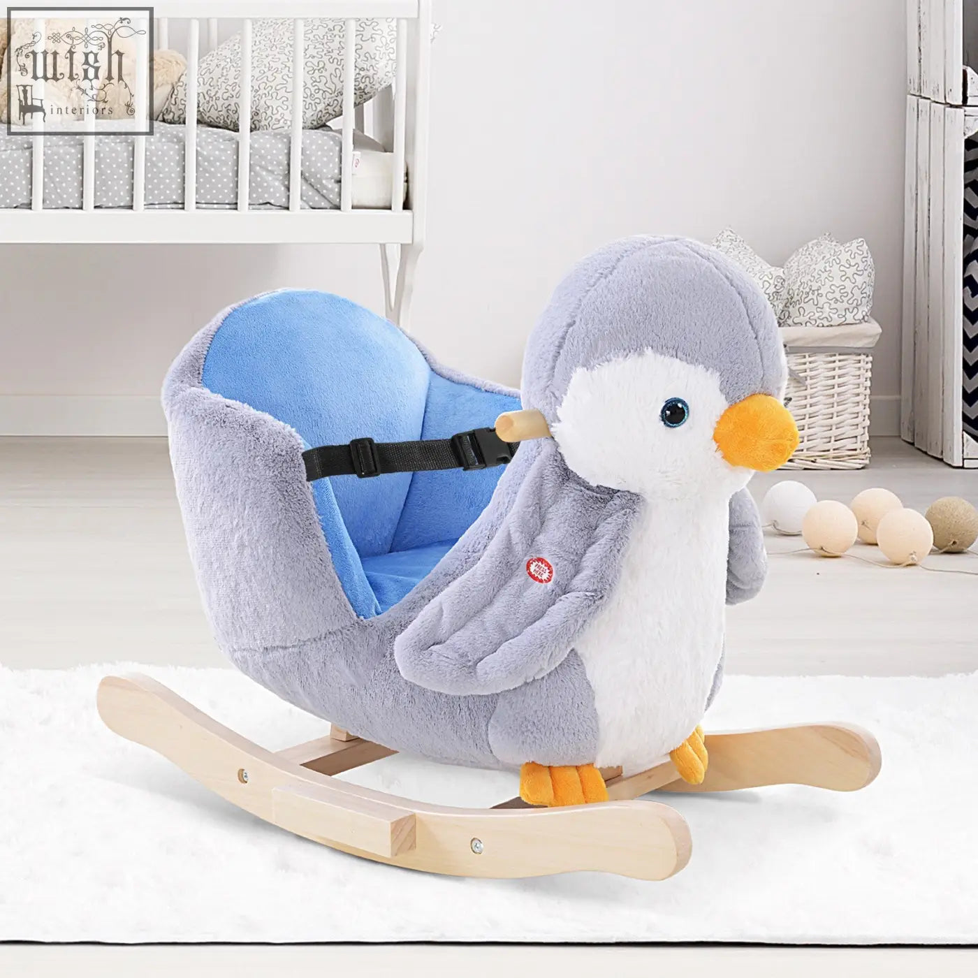 A plush gray and white penguin rocking horse with blue seat wooden rockers reinforced steel frame and music button