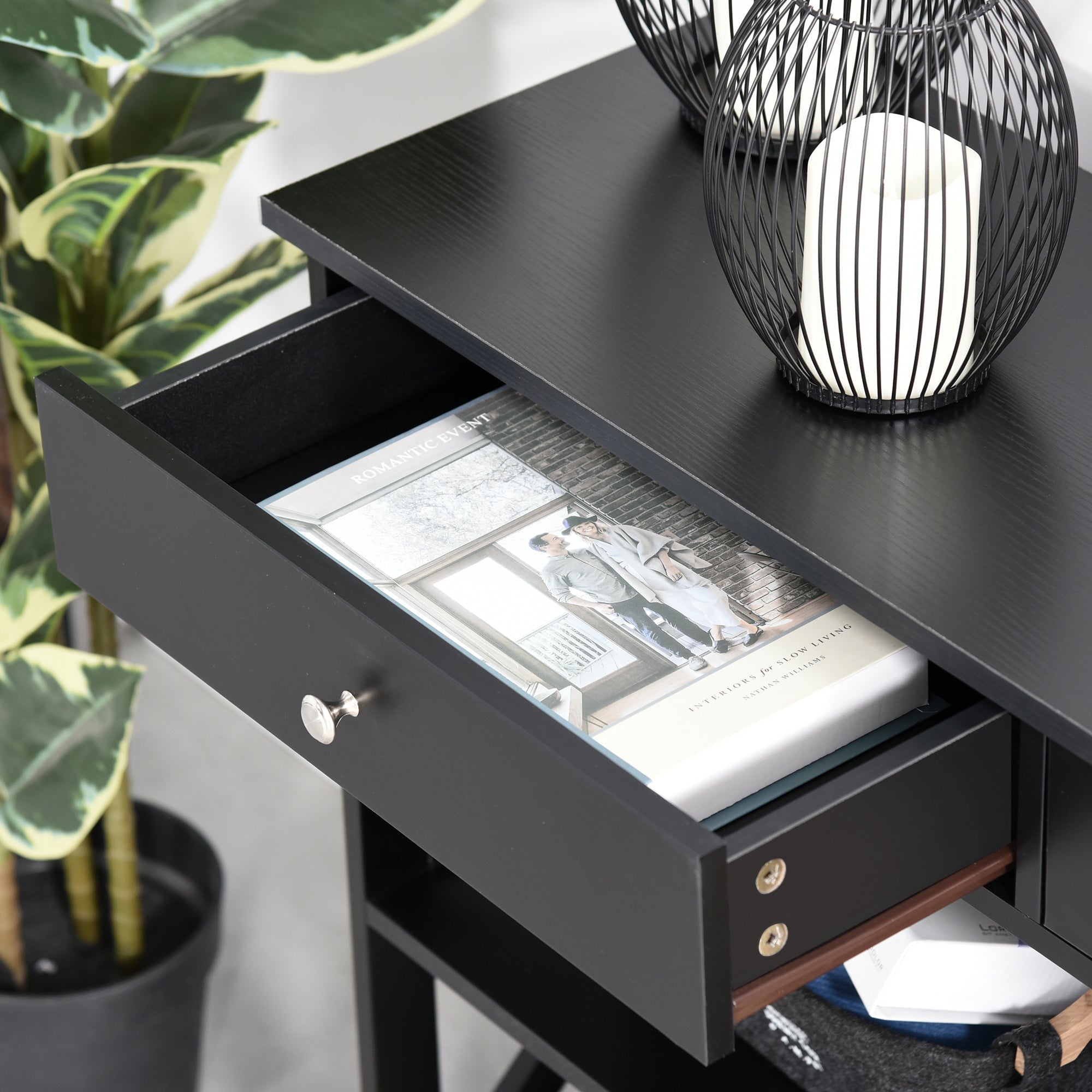 Black minimalist console table with a single drawer silver knob wood accents perfect for living room hallway or home office