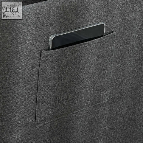Dark gray textured fabric tote bag with front pocket holding phone next to grey homcom chair bed with thick padded seat