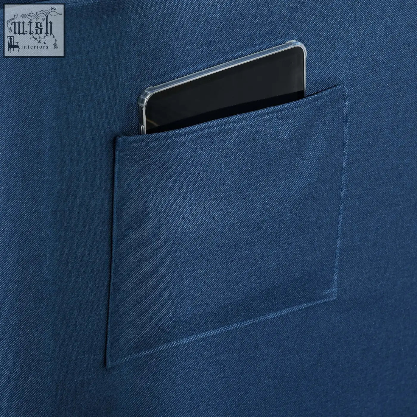 Deep blue denim textured pocket with smartphone on blue homcom chair bed with thick padded seat for studio flats