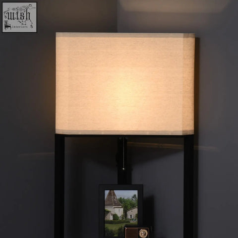 Beige rectangular fabric lampshade on black metal frame of homcom floor lamp with three shelves for living room
