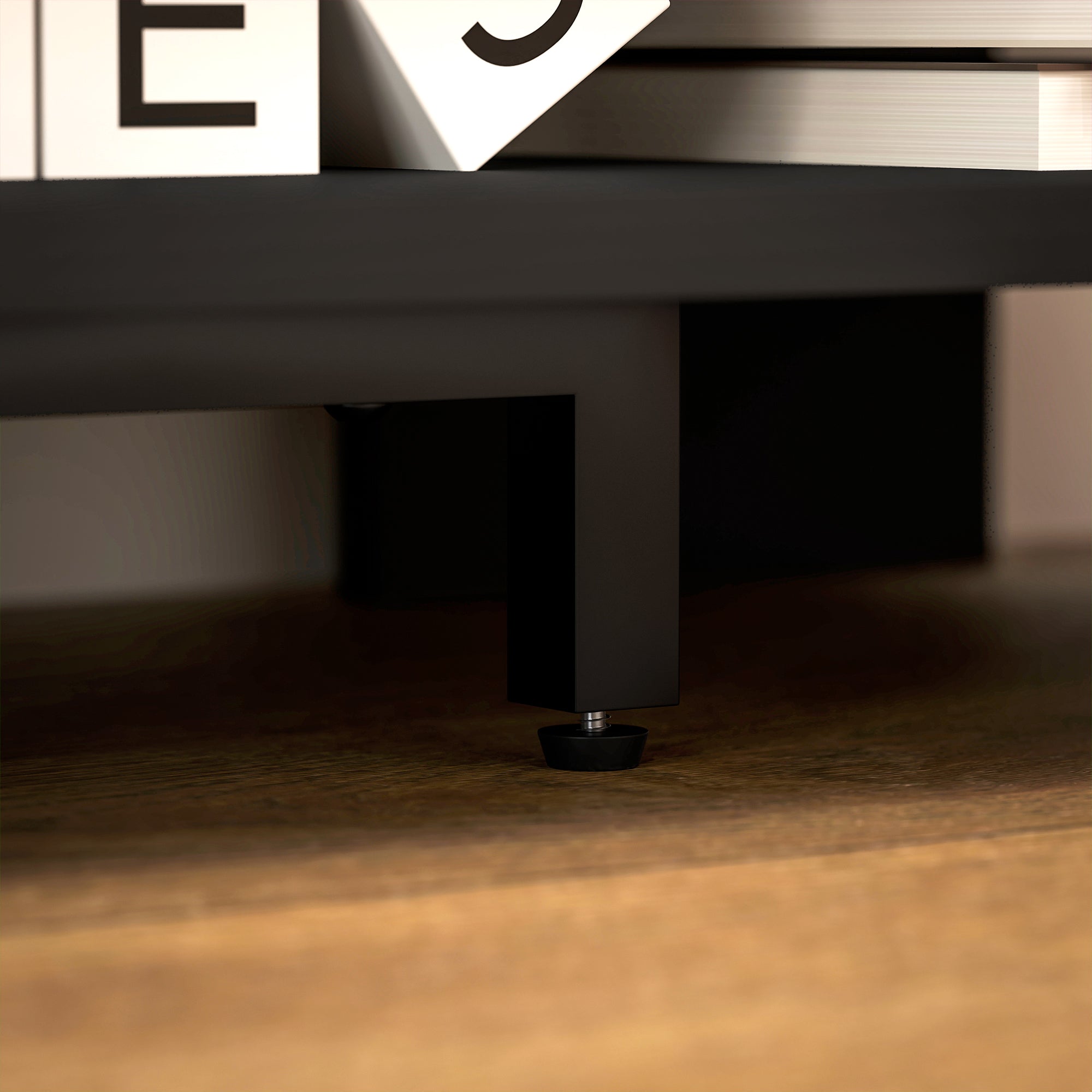 Black metal leg with circular rubber foot from homcom corner tv stand with two open shelves in black color