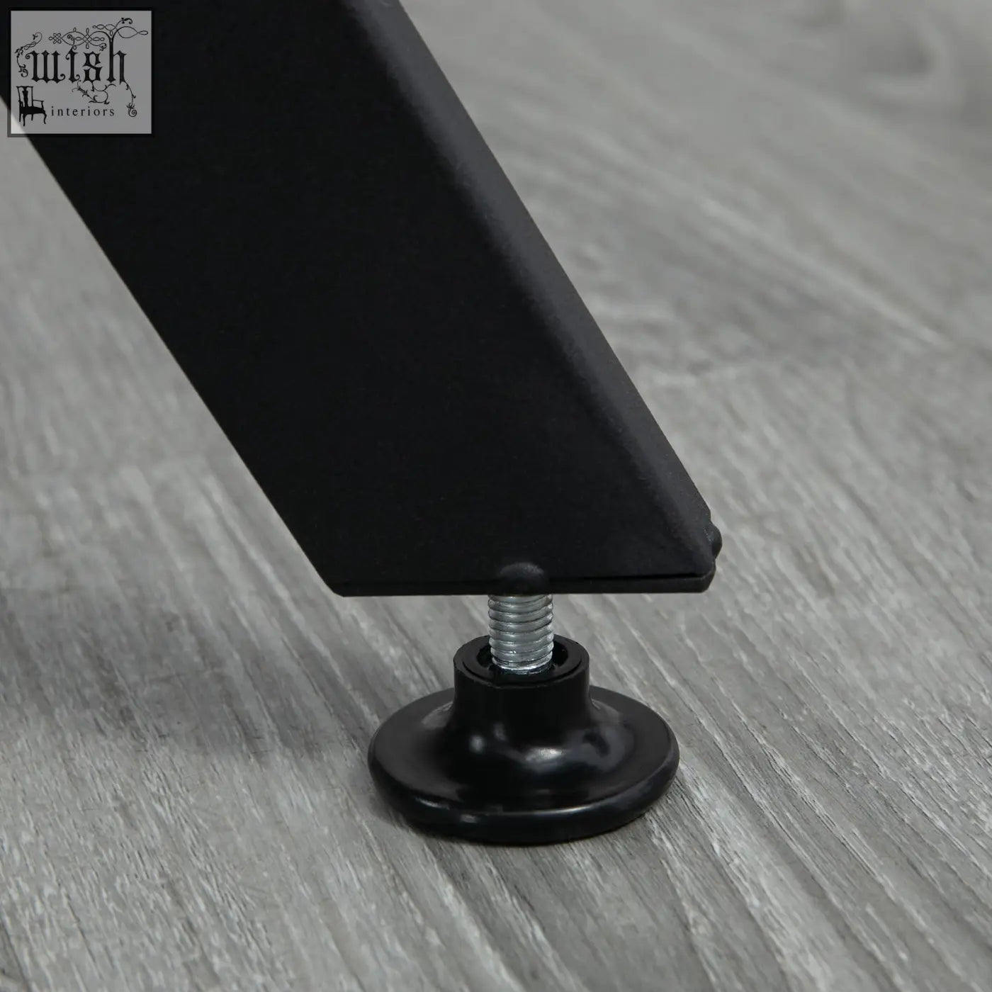 Black plastic adjustable leg foot with metallic screw and foot pads on homcom dining room table black legs