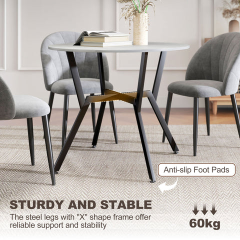 Modern round dining table with white marble top black steel x frame legs and anti slip foot pads for dining room