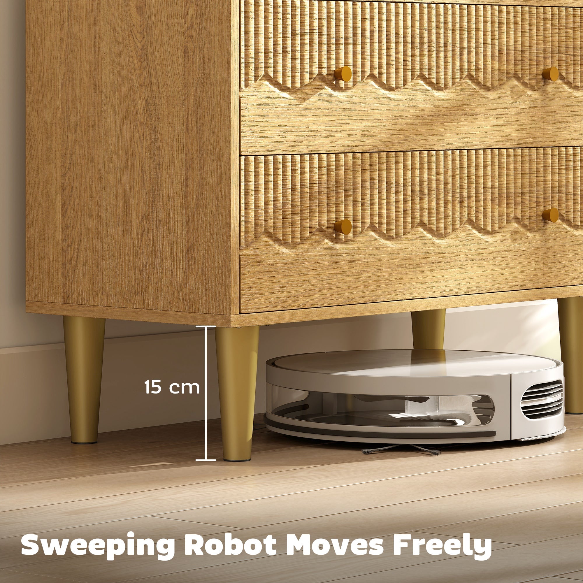White and silver robotic vacuum cleaner with circular design and transparent housing near oak grain dresser with three spacious drawers