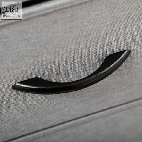 Black curved drawer handle on homcom fabric chest with grey fabric drawers and sturdy steel frame close-up view