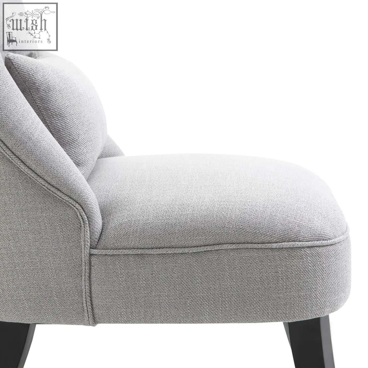 Gray upholstered accent chair with textured fabric and solid dark wood legs perfect for living room furniture