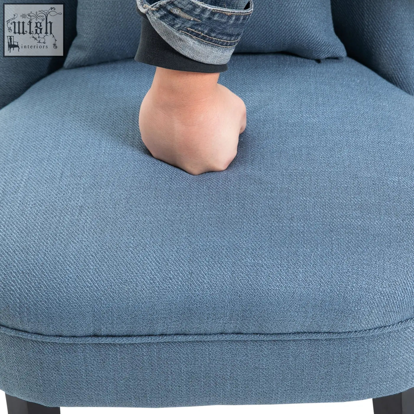Blue upholstered accent chair with linen-look fabric textured finish and solid wood legs for living room use