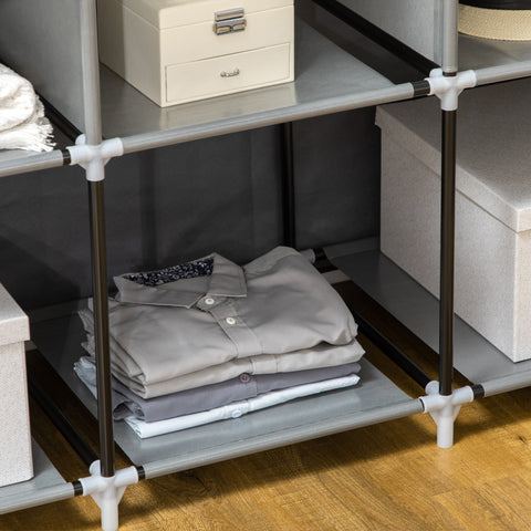 Gray fabric shelf with black and white connectors in homcom portable wardrobe with hanging rod and clothes storage use