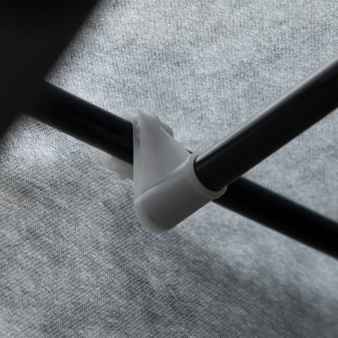 White plastic pipe clamp securing two black poles on the back of homcom fabric wardrobe with hanging rod and clothes storage